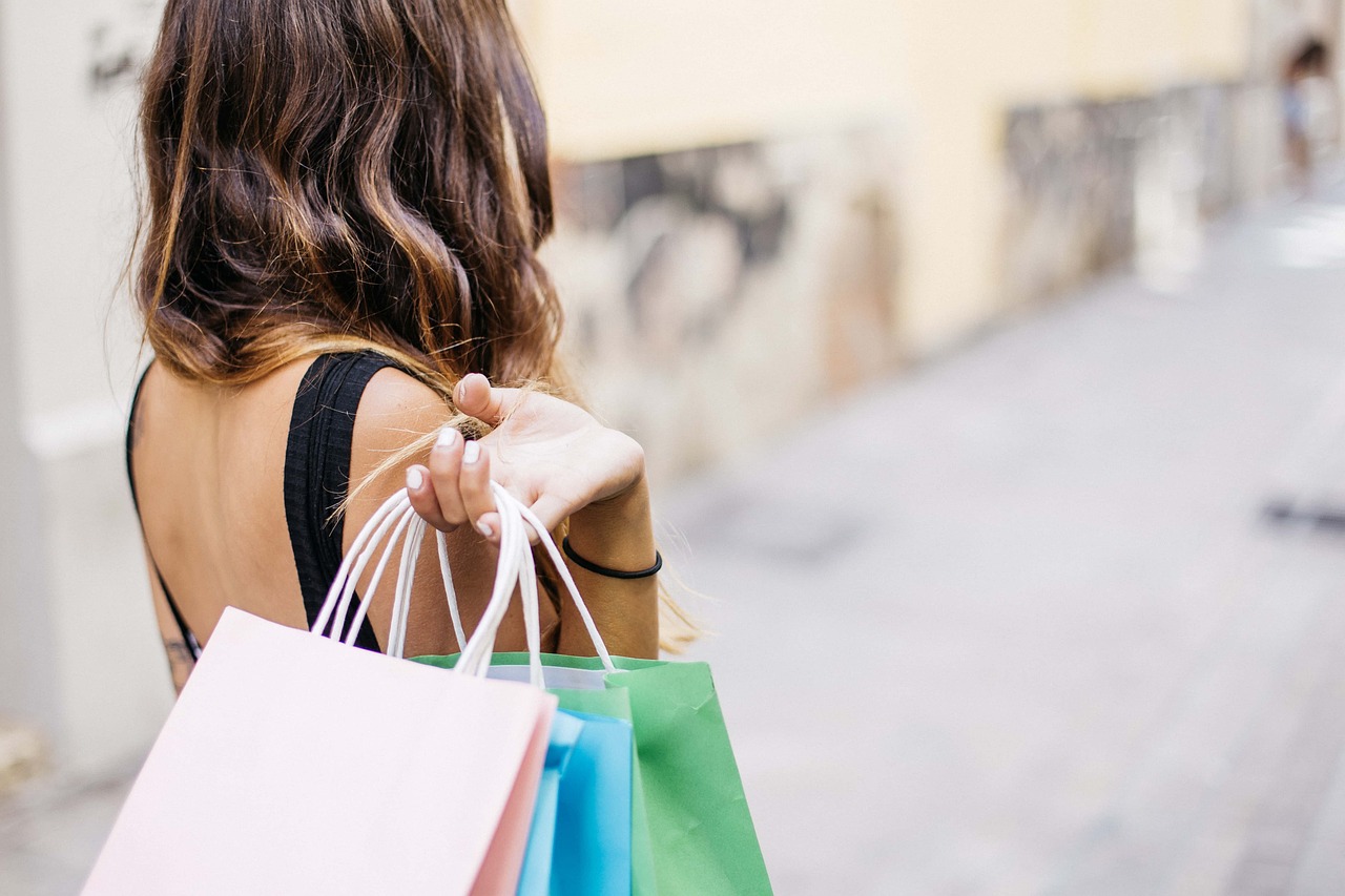 Woman shopping holding multiple shopping bags